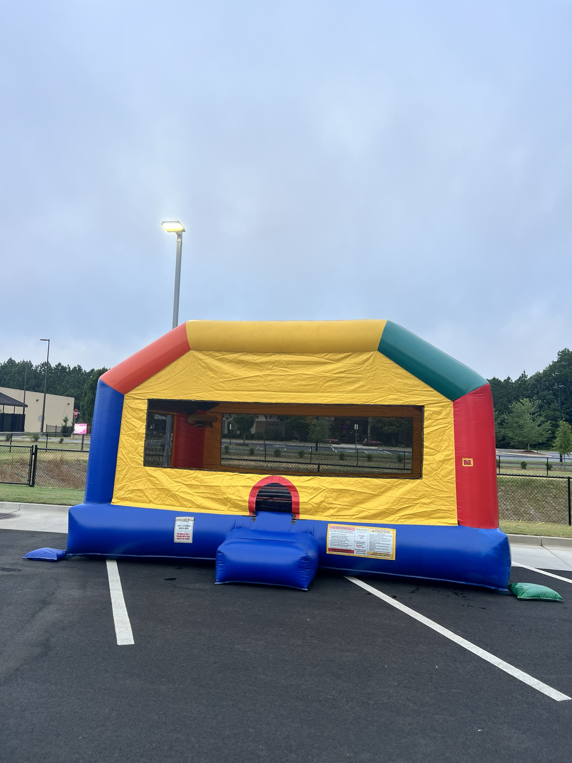 Fun House XL bounce house at a McDonald's grand opening in Hiram