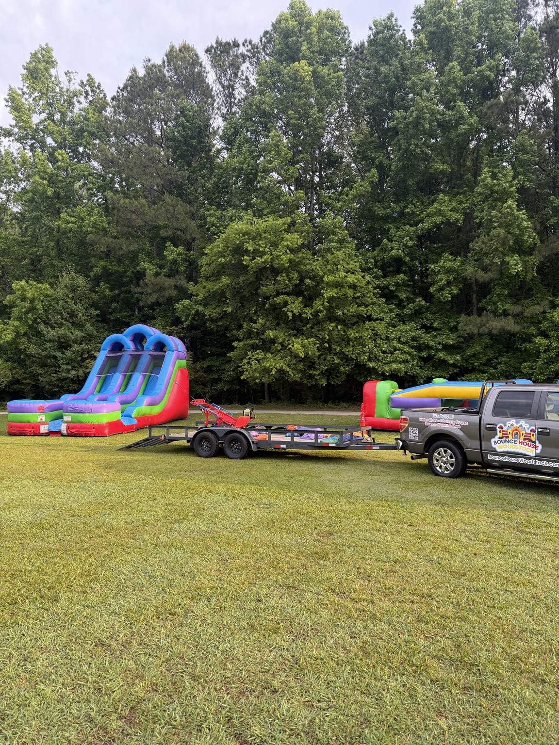 Bounce House Woodstock equipment and branded vehicle at Johnson Elementary