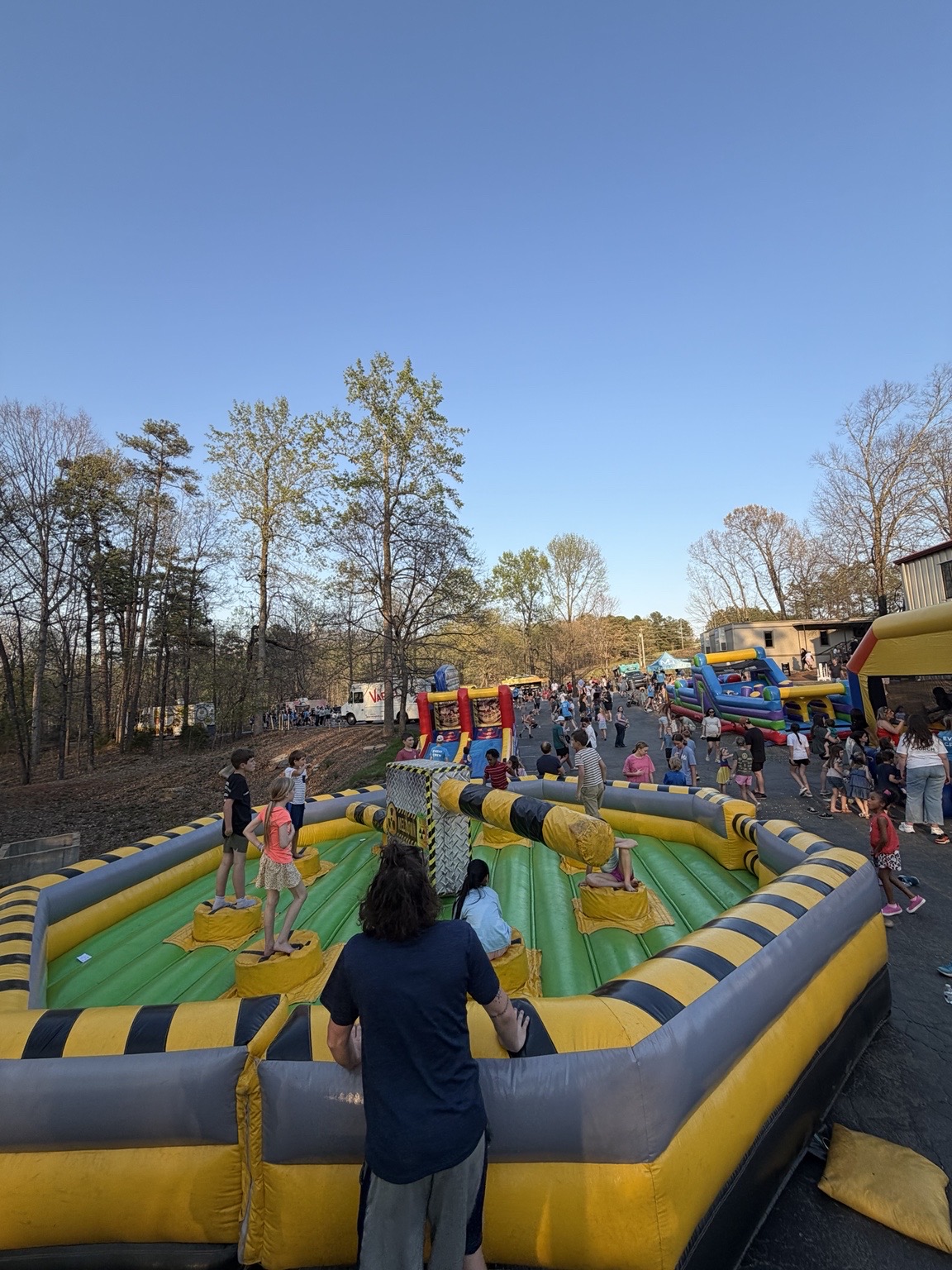 Mars Hill Community Church public spring event with families and multiple inflatable attractions