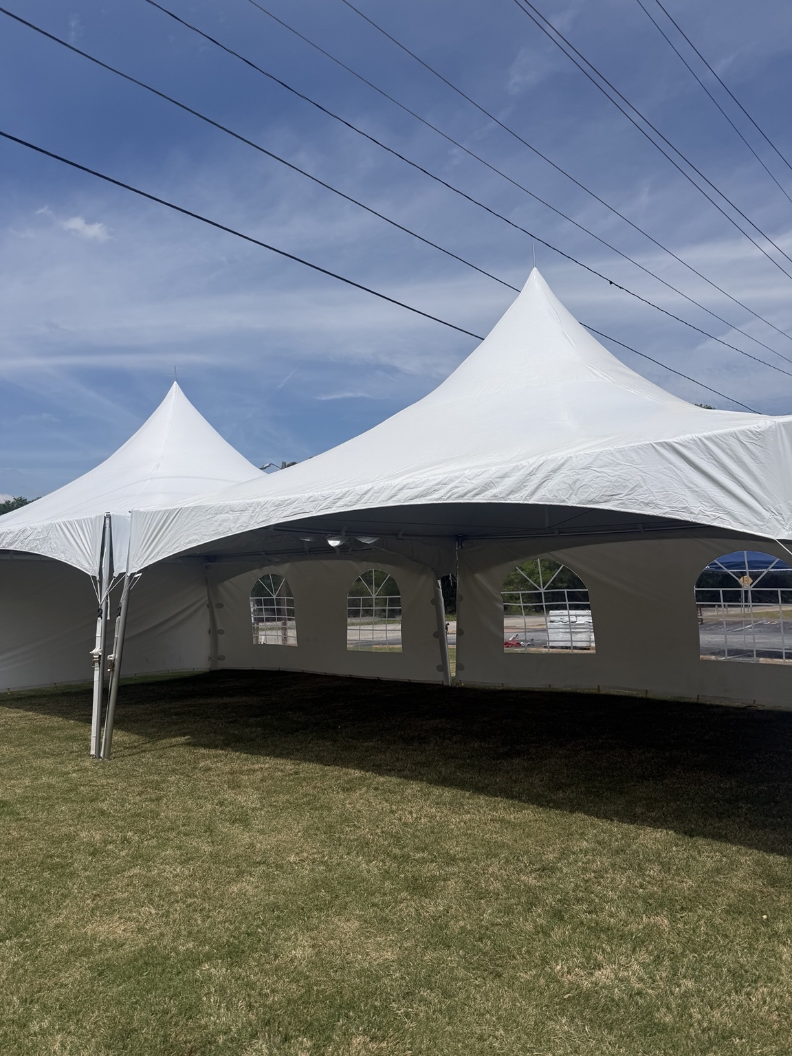 20-by-40 tent setup with window sidewalls for a corporate picnic