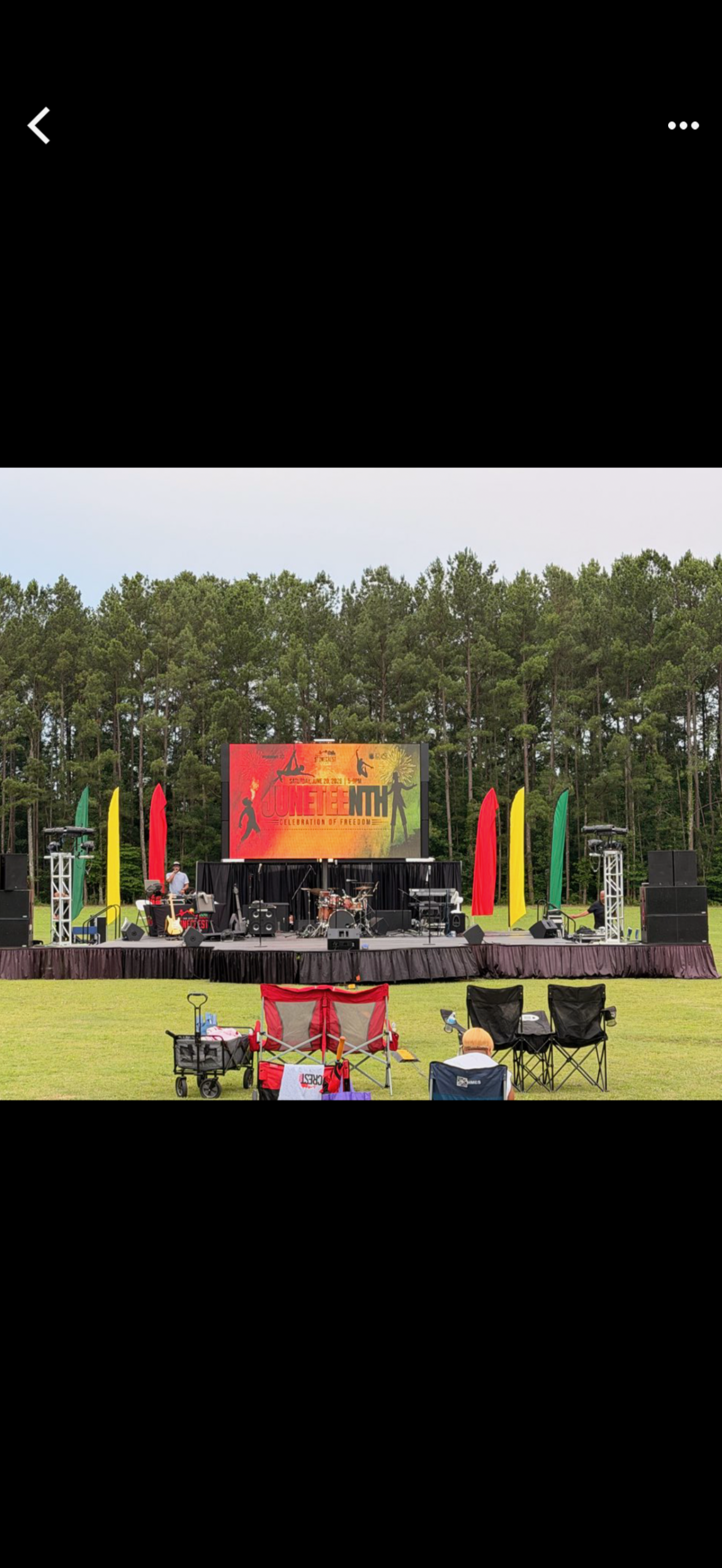 Large outdoor LED screen at a Juneteenth community event
