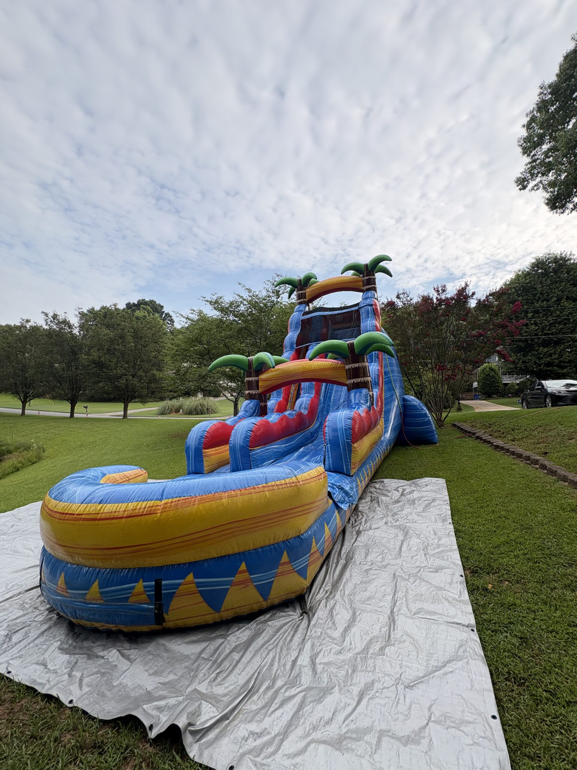22 foot tropical water slide rental delivered and set up by Bounce House Woodstock