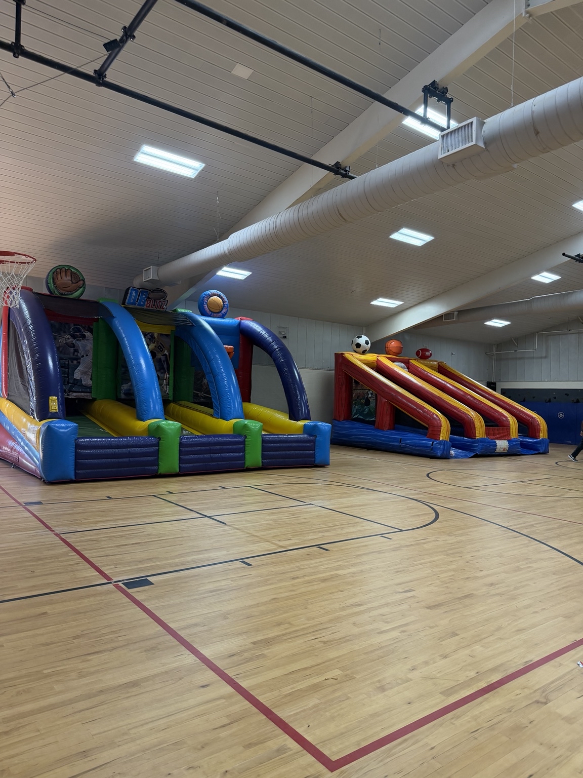 Interactive inflatables set up inside a gym
