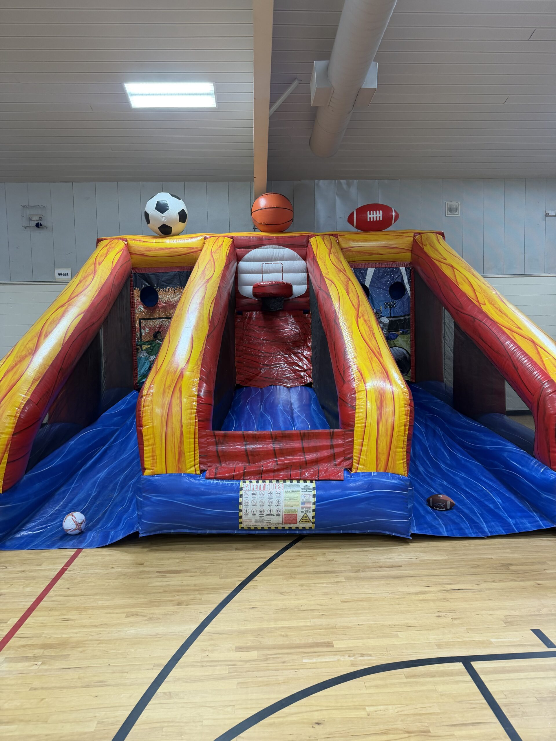 Multi-sport inflatable game inside a gym