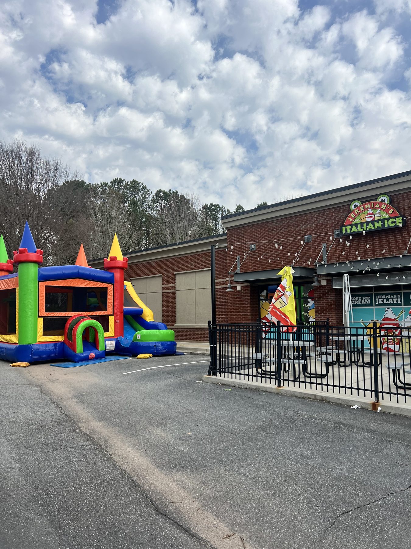 Carnival bounce and slide combo installed at Jeremiah's Italian Ice